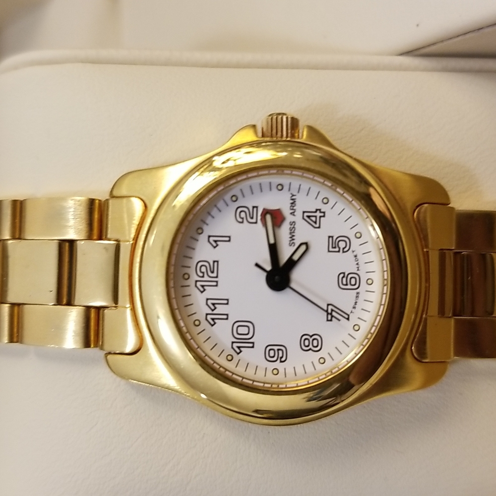 Women Swiss Army watch.  New with original box.  Gold stainless steel.